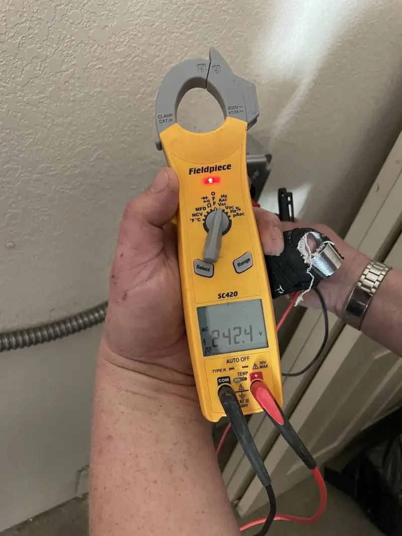 Voltage testing with clamp meter during Aluminum Wiring Replacement in Buford